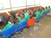 But we weren't the only ones who were excited! Rwandan schoolchildren using the computers in the Kigali Public Library's children's section.