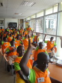 Rwandan schoolchildren participating in a book discussion in the Kigali Public Library's children's section.